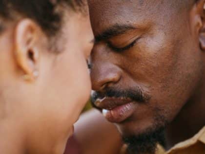 Love, intimate and black couple hugging on a date for romance, care and intimacy together. Romantic.